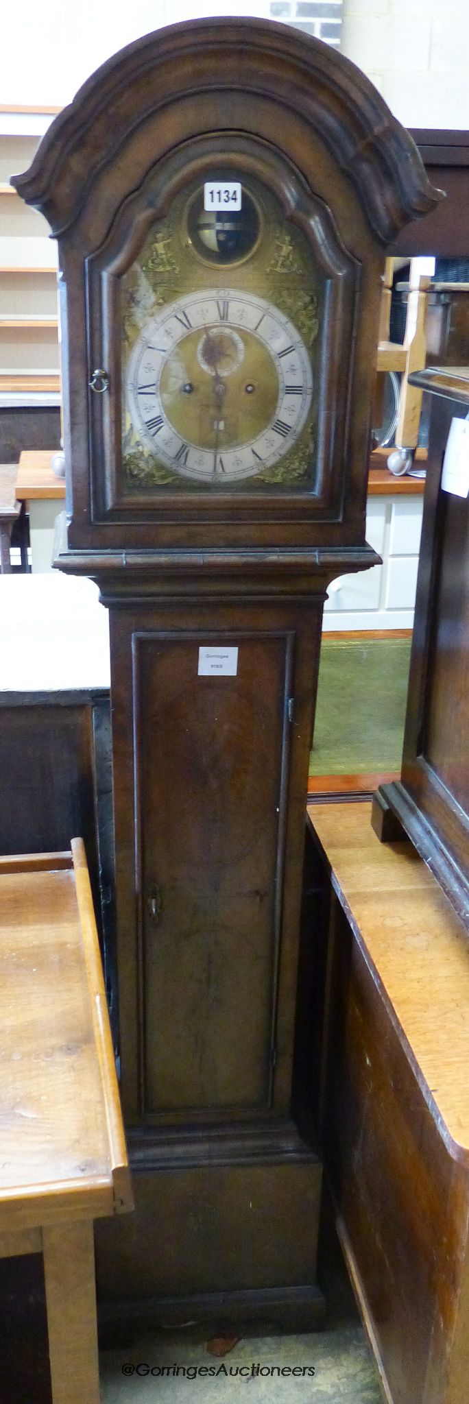 An 18th century style 8 day walnut grandmother clock, with globe and calendar aperture. H-156cm.